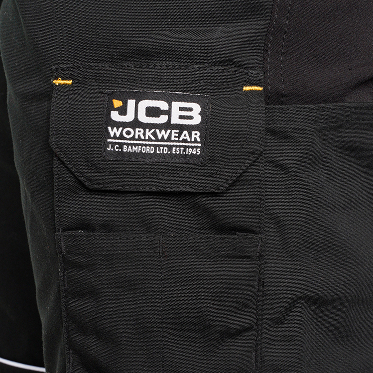 részlet JCB Trade Hybrid Stretch černé pánské pracovní kalhoty